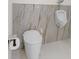 Contemporary bathroom featuring a wall-mounted urinal and modern toilet at 1978 Country Club Dr, Port Orange, FL 32128