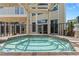 Inviting outdoor hot tub with pergola cover and surrounding patio at 1978 Country Club Dr, Port Orange, FL 32128