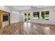 Bright living room with hardwood floors, fireplace and view to golf course at 1978 Country Club Dr, Port Orange, FL 32128