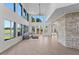 Spacious living area with high ceilings and stone feature wall at 1978 Country Club Dr, Port Orange, FL 32128