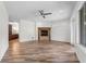 Main bedroom with hardwood floors and a fireplace at 1978 Country Club Dr, Port Orange, FL 32128