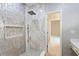 Elegant shower with marble and mosaic tile, and a built-in shelf at 1978 Country Club Dr, Port Orange, FL 32128