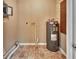 Laundry area with water heater and pegboard at 41 Villa Villar Ct # 41, Deland, FL 32724