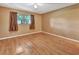 Empty bedroom with wood floors and ample natural light at 41 Villa Villar Ct # 41, Deland, FL 32724