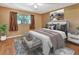 Spacious bedroom featuring a king-size bed and wood floors at 41 Villa Villar Ct # 41, Deland, FL 32724