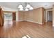 Large living area with hardwood floors and a view to the kitchen at 41 Villa Villar Ct # 41, Deland, FL 32724