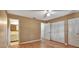 Bedroom with wood floors and access to the bathroom at 41 Villa Villar Ct # 41, Deland, FL 32724