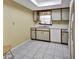 Efficient kitchen with white appliances and wood cabinets at 41 Villa Villar Ct # 41, Deland, FL 32724