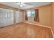 Simple bedroom with wood floors and large closet at 41 Villa Villar Ct # 41, Deland, FL 32724