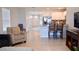 Open living room with kitchen view and access to backyard at 226 Meghan Cir, Deland, FL 32724