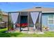 House exterior with screened patio and landscaping at 226 Meghan Cir, Deland, FL 32724