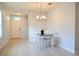 Bright dining room features a table with four chairs and a modern chandelier at 226 Meghan Cir, Deland, FL 32724