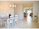 Bright dining room with a table and chairs, view to living room at 226 Meghan Cir, Deland, FL 32724