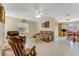 Open living room with leather couches and a rocking chair at 134 Avalon Dr # A, Ormond Beach, FL 32176