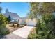 Cute yellow house with a white garage door and well-manicured landscaping at 134 Avalon Dr # A, Ormond Beach, FL 32176