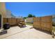 Concrete patio area with wooden privacy fence and a picnic table, perfect for outdoor dining at 134 Avalon Dr # A, Ormond Beach, FL 32176