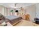 Main bedroom with a large bed and access to the backyard at 134 Avalon Dr # A, Ormond Beach, FL 32176