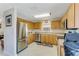 Kitchen with stainless steel appliances and light wood cabinets at 134 Avalon Dr # A, Ormond Beach, FL 32176