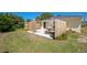 Private backyard with a wooden fence, patio, picnic table, and plenty of grass space at 134 Avalon Dr # A, Ormond Beach, FL 32176