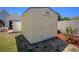 Detached storage shed painted yellow with white trim, offering extra storage space at 134 Avalon Dr # A, Ormond Beach, FL 32176