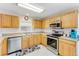Modern kitchen with stainless steel appliances and wood cabinets at 134 Avalon Dr # A, Ormond Beach, FL 32176