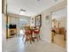 Small breakfast nook with a round table and red chairs at 134 Avalon Dr # A, Ormond Beach, FL 32176
