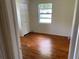 Simple bedroom with hardwood floors and a closet at 2202 Lake Ruby Rd, Deland, FL 32724