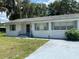 Brick house with a covered entryway and landscaping at 2202 Lake Ruby Rd, Deland, FL 32724