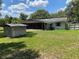 House exterior with screened porch and yard at 2202 Lake Ruby Rd, Deland, FL 32724