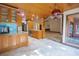 Open kitchen with wood cabinets, granite countertops, and a breakfast bar at 121 Willow Bend Ln, Ormond Beach, FL 32174