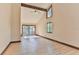Bright living room with vaulted ceiling, hardwood floors, and sliding glass doors at 121 Willow Bend Ln, Ormond Beach, FL 32174
