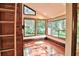 Bright sunroom with hardwood floors and abundant natural light at 121 Willow Bend Ln, Ormond Beach, FL 32174