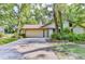 Single-story home with attached garage and a large front yard at 121 Willow Bend Ln, Ormond Beach, FL 32174