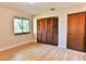 Bedroom with hardwood floors, large closet, and window at 121 Willow Bend Ln, Ormond Beach, FL 32174