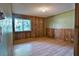 Bedroom with wood paneled walls and hardwood floors at 121 Willow Bend Ln, Ormond Beach, FL 32174