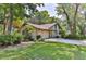 Single-story home with attached garage and attractive landscaping at 121 Willow Bend Ln, Ormond Beach, FL 32174