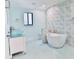 Spa-like bathroom featuring a freestanding tub and walk-in shower at 121 Willow Bend Ln, Ormond Beach, FL 32174