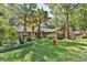 Lovely home with mature trees and landscaping, creating a serene atmosphere at 121 Willow Bend Ln, Ormond Beach, FL 32174
