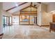 Open living area with high ceilings, stone fireplace, and a loft at 121 Willow Bend Ln, Ormond Beach, FL 32174