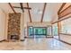 Spacious living room featuring a stone fireplace and high ceilings at 121 Willow Bend Ln, Ormond Beach, FL 32174