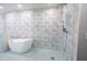 Elegant bathroom with a large walk-in shower and freestanding tub at 121 Willow Bend Ln, Ormond Beach, FL 32174