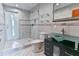 Modern bathroom with glass shower, updated vanity, and tiled floors at 121 Willow Bend Ln, Ormond Beach, FL 32174