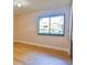 Well-lit bedroom with hardwood floors and a view of the backyard at 121 Willow Bend Ln, Ormond Beach, FL 32174