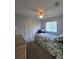 Bedroom with carpet floors, built in closet and window at 833 E 22Nd Ave, New Smyrna Beach, FL 32169