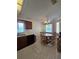 Cozy kitchen with wood cabinets, stainless steel appliances, and breakfast nook at 833 E 22Nd Ave, New Smyrna Beach, FL 32169