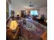 Living room with hardwood floors, large windows and comfortable seating at 833 E 22Nd Ave, New Smyrna Beach, FL 32169