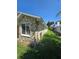 House exterior showcasing a stone facade and well-manicured lawn at 833 E 22Nd Ave, New Smyrna Beach, FL 32169