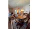 Bright dining room featuring hardwood floors and a charming wooden table at 833 E 22Nd Ave, New Smyrna Beach, FL 32169