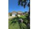 Front view of single-story house with garage and landscaping at 833 E 22Nd Ave, New Smyrna Beach, FL 32169