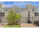 Modern townhome with two-car garage and stone accents at 505 Ocean Course Ave # 505, Davenport, FL 33896